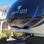 98afcd_cceff02f80024d52af5dd99e0f67d7d1f000 Close-up of a Beacon Vanleigh RV logo.