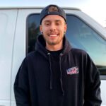 unnamed-1 Smiling young man in front of a van.