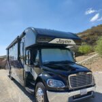 20220617_153204 Black Jayco recreational vehicle parked under blue sky.