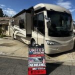 IMG_6709 Luxury RV parked with detailing service sign