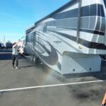 VideoCapture_20230118-155615 Person washing a large recreational vehicle outdoors