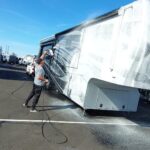 VideoCapture_20230118-155702 A person washing an RV with spray foam.